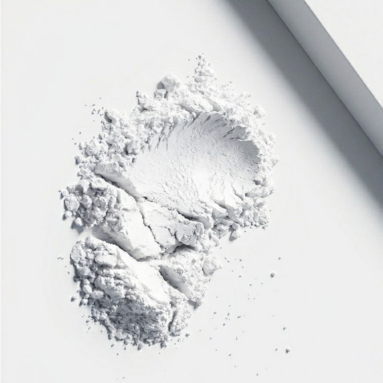 White powder on a white surface with a light gray border
